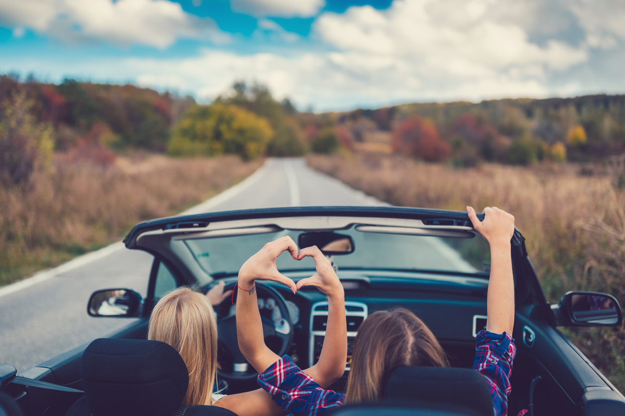 Young Women On A Road Trip With Cabriolet