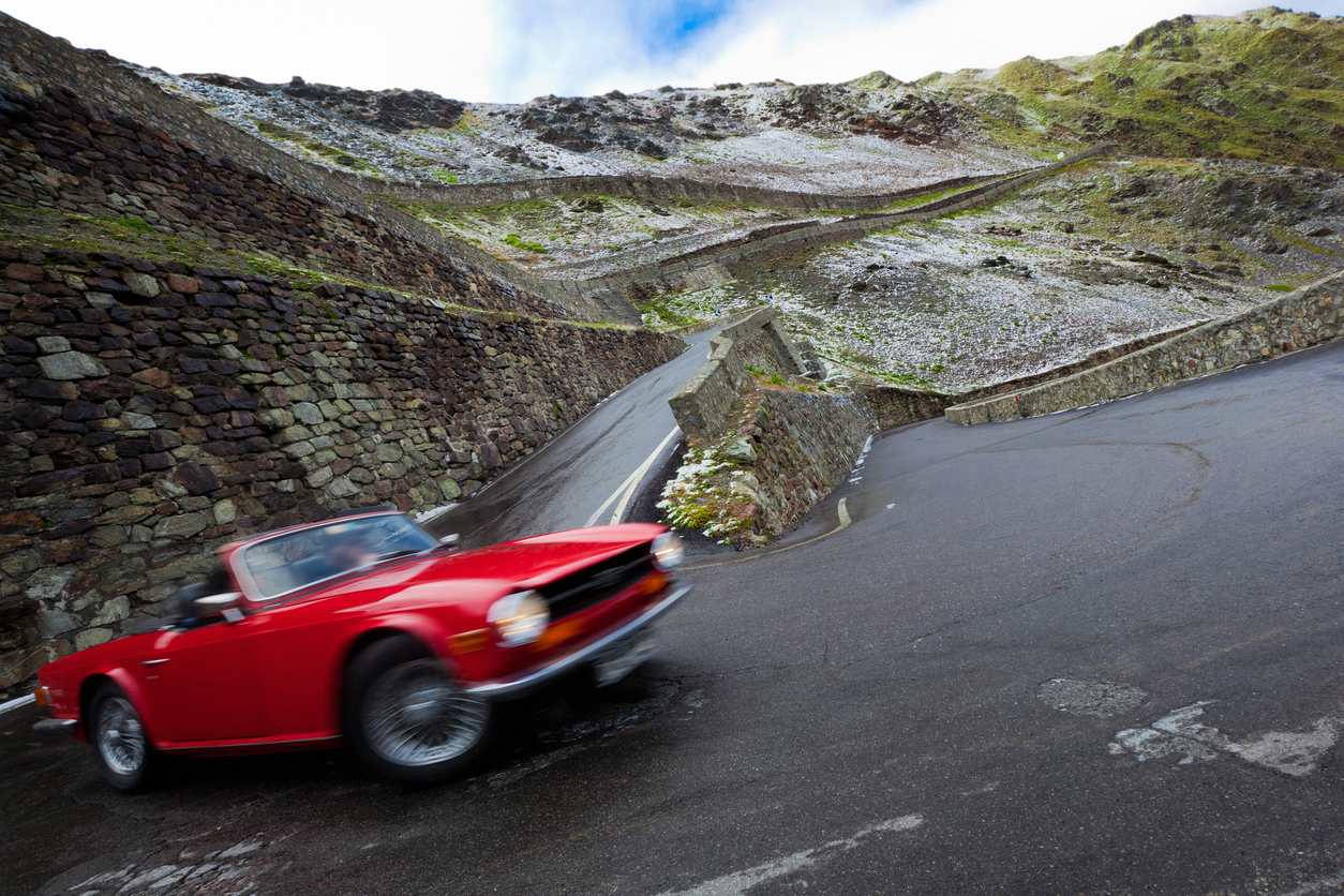Red Retro Car Driving On A Mountain Road Roadtrip Travel