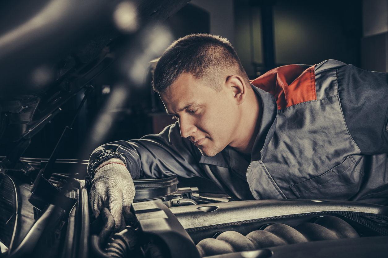 Professional Car Mechanic Working In Auto Repair Service