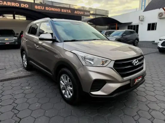 Hyundai Creta de cor prata disponível para venda por até 100 mil reais, ideal para quem busca um SUV econômico e confiável.